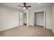 Well-lit bedroom featuring ceiling fan and closet at 2765 Old Villa Rica Rd, Powder Springs, GA 30127