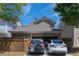 View of the detached two-car garage with two cars parked inside at 4835 Abberley Ln, Alpharetta, GA 30022