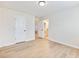 Light-filled bedroom with wood floors and en-suite bathroom access at 4045 Hosch Retreat Drive, Buford, GA 30519