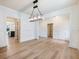 Spacious dining room with chandelier and hardwood floors at 4045 Hosch Retreat Drive, Buford, GA 30519