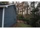 Side yard with wooded view and a partial fence at 4120 Highway 92, Acworth, GA 30102