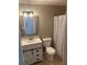 Bathroom with white vanity, decorative mirror, and shower/tub combo at 1166 Booth Sw Rd # 610, Marietta, GA 30008