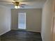 Spacious bedroom, featuring neutral walls, gray flooring, and a ceiling fan at 1166 Booth Sw Rd # 610, Marietta, GA 30008