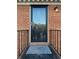 Inviting front door with a welcome mat and black railing at 1166 Booth Sw Rd # 610, Marietta, GA 30008