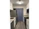 Modern kitchen with white cabinets, stainless steel appliances, and granite countertops at 1166 Booth Sw Rd # 610, Marietta, GA 30008