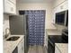 Updated kitchen featuring white shaker cabinets, stainless steel appliances, and granite countertops at 1166 Booth Sw Rd # 610, Marietta, GA 30008