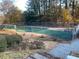 Community tennis court with chain link fence and wind screen at 1166 Booth Sw Rd # 610, Marietta, GA 30008