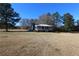 Charming home with covered porch and expansive front yard at 5333 Pine Valley Rd, Powder Springs, GA 30127