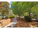 Community playground nestled among mature trees at 2622 Neighborhood Walk, Villa Rica, GA 30180