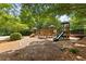 Modern playground equipment in a shady play area at 2622 Neighborhood Walk, Villa Rica, GA 30180