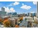 Aerial view of a cityscape with buildings and a construction crane at 855 Peachtree Ne St # 2412, Atlanta, GA 30308