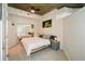 Comfortable bedroom with a king-size bed, mirrored closet, and ceiling fan at 855 Peachtree Ne St # 2412, Atlanta, GA 30308