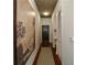 Bright entry hall with hardwood floors and large art piece at 855 Peachtree Ne St # 2412, Atlanta, GA 30308