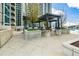 Community grilling area with pergola and seating at 855 Peachtree Ne St # 2412, Atlanta, GA 30308