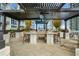 Outdoor kitchen with grill and seating under pergola at 855 Peachtree Ne St # 2412, Atlanta, GA 30308