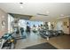 Modern gym with various equipment and large windows at 855 Peachtree Ne St # 2412, Atlanta, GA 30308