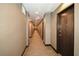 Building hallway with carpet and neutral walls at 855 Peachtree Ne St # 2412, Atlanta, GA 30308