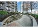 Landscaped rooftop garden with a peaceful walking path at 855 Peachtree Ne St # 2412, Atlanta, GA 30308