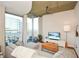 Spacious living room with hardwood floors and city views at 855 Peachtree Ne St # 2412, Atlanta, GA 30308