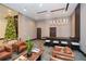 Inviting lobby area with comfortable leather seating, a bar area, and a decorated Christmas tree at 855 Peachtree Ne St # 2412, Atlanta, GA 30308