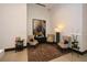 Quiet seating area in the lobby with modern armchairs, soft lighting, and tasteful artwork at 855 Peachtree Ne St # 2412, Atlanta, GA 30308