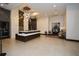 Spacious lobby with modern chandelier, reception desk, and seating area at 855 Peachtree Ne St # 2412, Atlanta, GA 30308