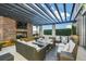 Cozy outdoor patio with fireplace and comfortable seating at 855 Peachtree Ne St # 2412, Atlanta, GA 30308