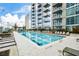 Resort-style pool with plenty of lounge chairs at 855 Peachtree Ne St # 2412, Atlanta, GA 30308