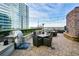 Stainless steel grill and comfortable seating on rooftop deck at 855 Peachtree Ne St # 2412, Atlanta, GA 30308