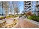 Landscaped rooftop garden with a peaceful walkway at 855 Peachtree Ne St # 2412, Atlanta, GA 30308
