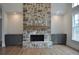 Stone fireplace with wood mantel and built-in cabinets at 325 Mont Harmony Sw Rd, Powder Springs, GA 30127