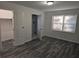 Bright bedroom with grey wood-look floors, en suite bathroom, and spacious closet at 4193 Port Chester Way, Decatur, GA 30034