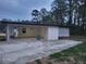 Attached carport with concrete slab and a storage area at 4193 Port Chester Way, Decatur, GA 30034