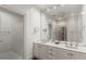 Bright bathroom with double vanity, large mirror, and white cabinetry at 207 Townsend Pl, Atlanta, GA 30327