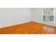 Bright bedroom with hardwood floors and large window at 3160 Seven Pines Ct # 301, Atlanta, GA 30339