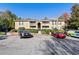 Apartment building exterior with parking spaces in front and landscaping at 3160 Seven Pines Ct # 301, Atlanta, GA 30339