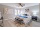 Spacious bedroom with a king-size bed and ceiling fan at 3814 Whaley Ct, Snellville, GA 30039