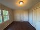 Well-lit bedroom with dark hardwood floors and double closets at 1657 Mcclelland Ave, Atlanta, GA 30344