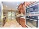 Modern kitchen with stainless steel appliances and wood cabinets at 207 Persimmon Trl, Woodstock, GA 30188