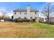 Backyard view of two-story home with deck and fenced yard at 4894 Brown Leaf Dr, Powder Springs, GA 30127