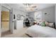 Gray bedroom featuring a bed, white dresser, and small desk with a chair at 4894 Brown Leaf Dr, Powder Springs, GA 30127