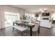 Bright dining area with sliding glass doors leading to a patio at 7759 Plymouth Dr, Fairburn, GA 30213