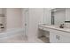 Modern bathroom with white cabinets, granite countertop, and black fixtures at 3934 Saddle Bag Ct, Dacula, GA 30019
