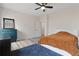 Spacious bedroom with plush carpeting, a ceiling fan, and large windows at 3934 Saddle Bag Ct, Dacula, GA 30019