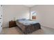 Cozy bedroom with a comfortable bed, nightstands, and soft carpeting at 3934 Saddle Bag Ct, Dacula, GA 30019