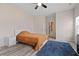 Cozy bedroom with soft lighting, a ceiling fan, and a comfortable bed at 3934 Saddle Bag Ct, Dacula, GA 30019