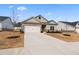 Attractive two-story house featuring a two-car garage and a well-maintained yard at 3934 Saddle Bag Ct, Dacula, GA 30019