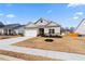 Inviting two-story home with a two-car garage and a landscaped front yard at 3934 Saddle Bag Ct, Dacula, GA 30019