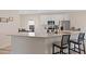 Stylish kitchen with white cabinets, granite countertops, and an island with bar seating at 3934 Saddle Bag Ct, Dacula, GA 30019