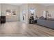 Bright living room with ample space, large windows, and wood-look flooring at 3934 Saddle Bag Ct, Dacula, GA 30019